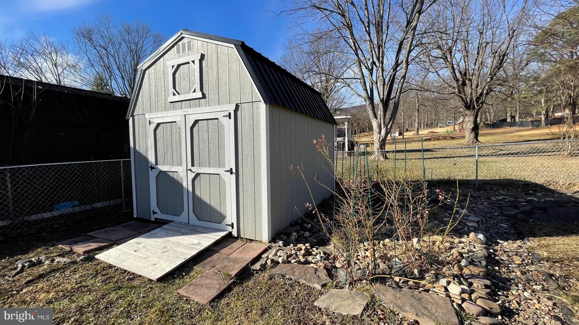81 Lester Street Keyser, WV 26726 - Photo 47 of 75 a view of a pathway of a house