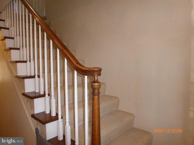 81 Lester Street Keyser, WV 26726 - Photo 5 of 75 a view of staircase with railing and white walls