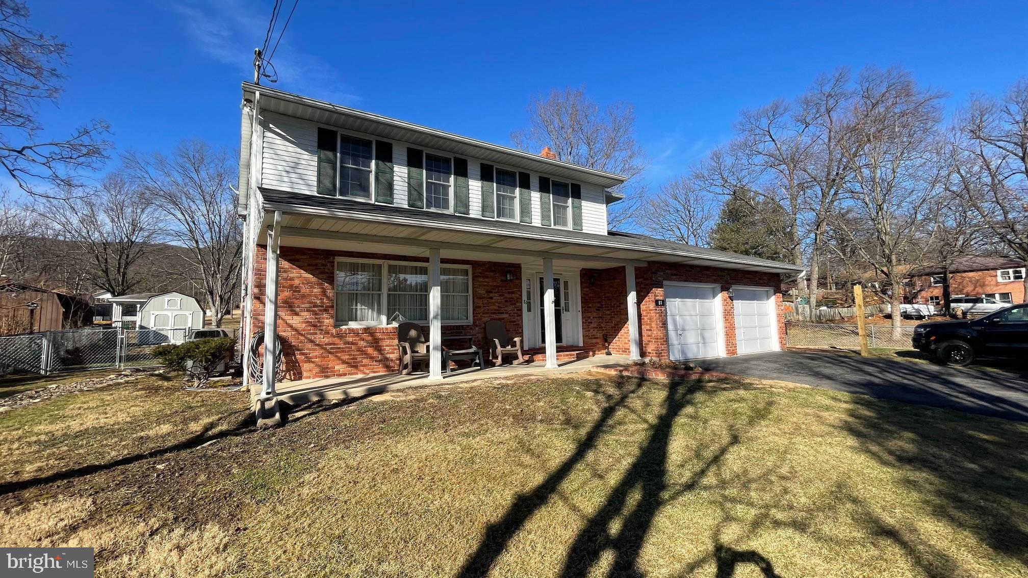 81 Lester Street Keyser, WV 26726 - Photo 55 of 75 a front view of a house with yard