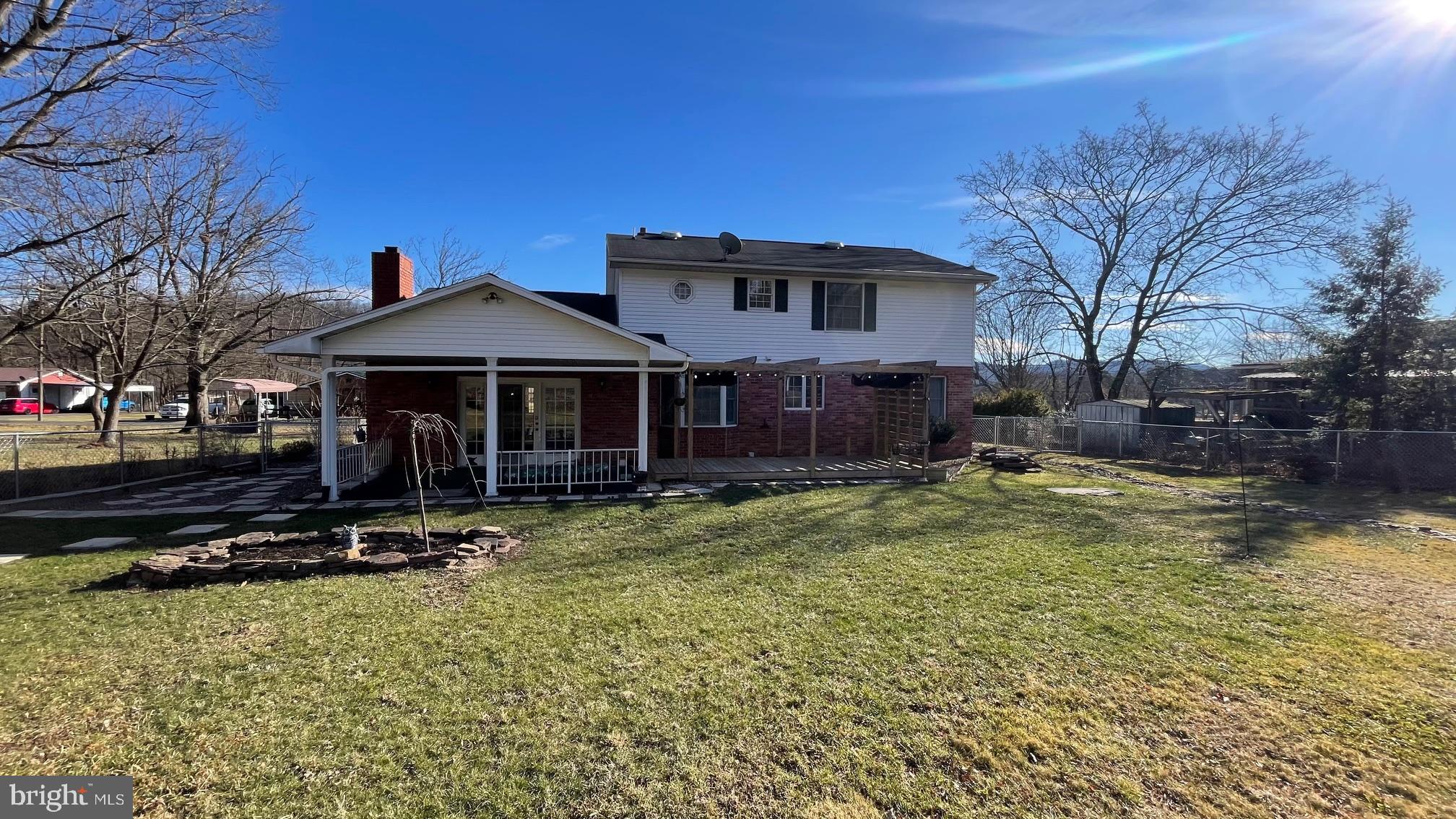 81 Lester Street Keyser, WV 26726 - Photo 58 of 75 a view of a house with a yard patio and fire pit