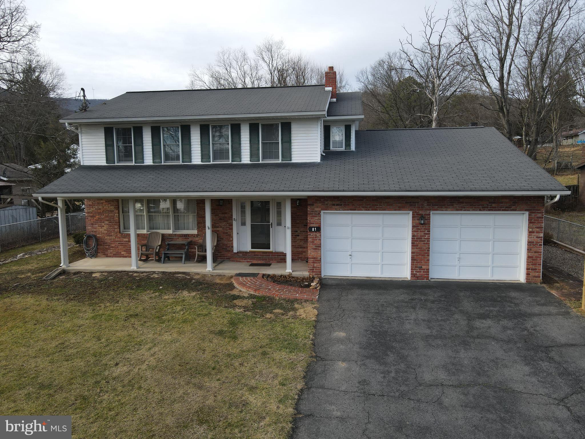 81 Lester Street Keyser, WV 26726 - Photo 64 of 75 a front view of a house with a yard and garage