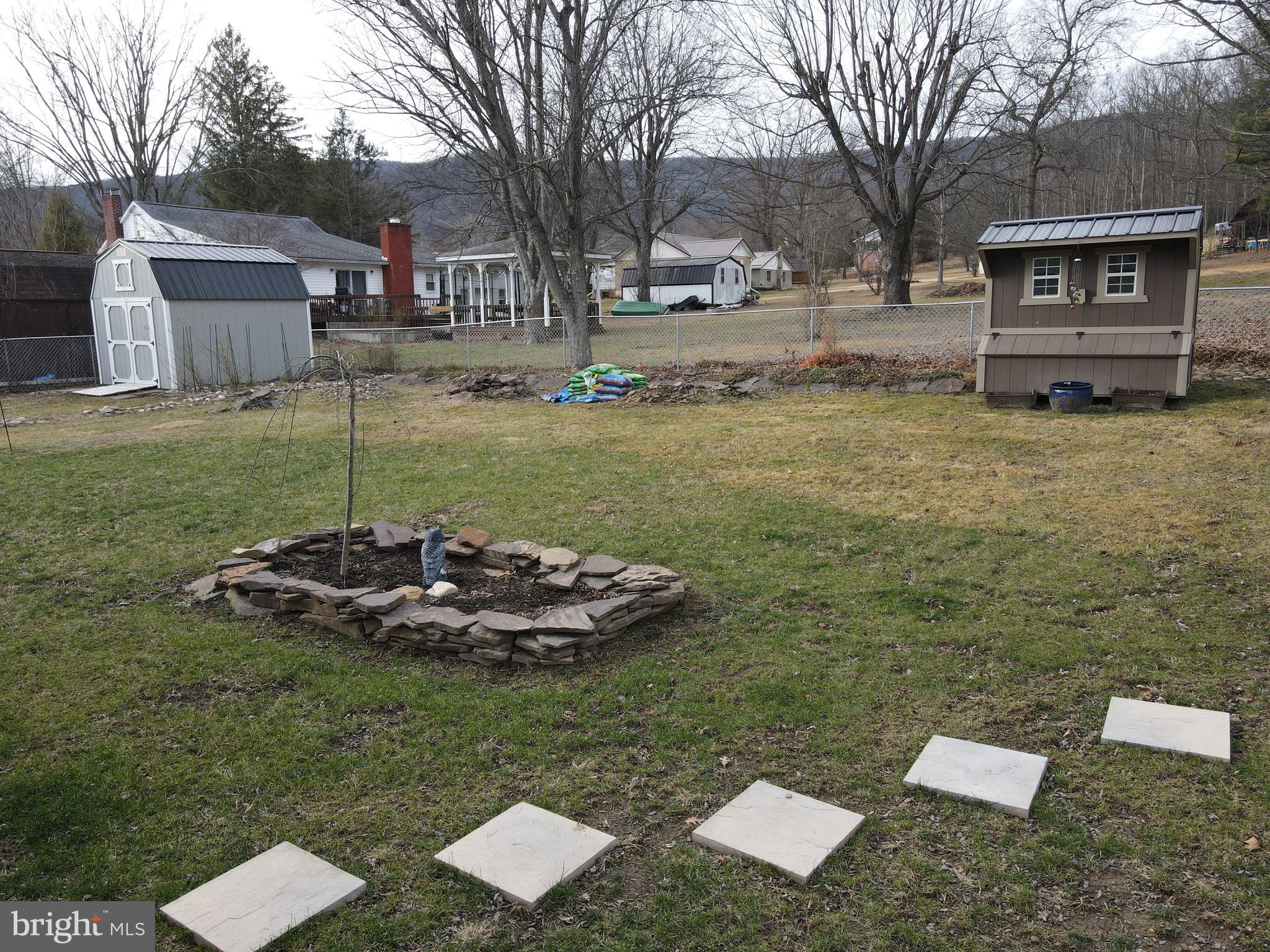 81 Lester Street Keyser, WV 26726 - Photo 73 of 75 a backyard of a house with lots of green space