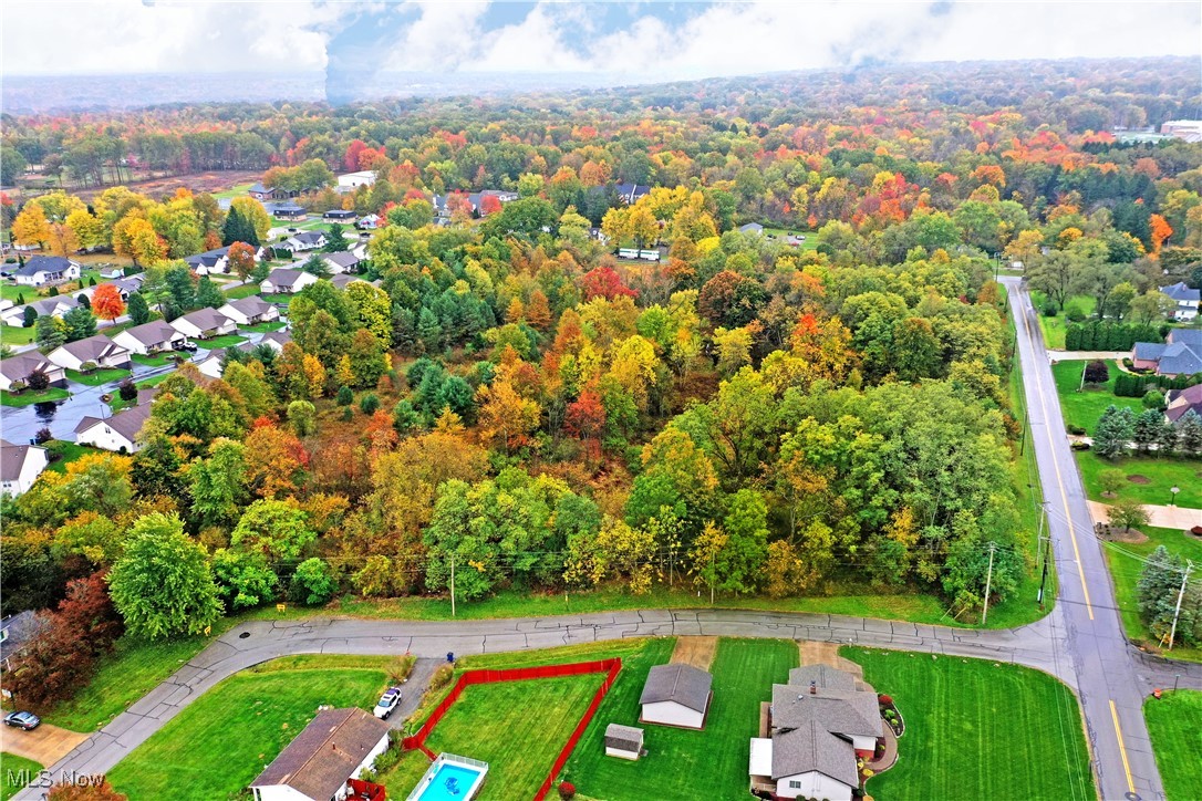 Hubbard Road Youngstown, OH 44505 - Photo 6 of 13 Aerial view of residential area with property parcel outlined and a heavily wooded area