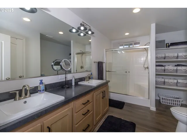 a bathroom with a sink vanity and a mirror