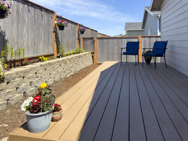 a backyard view with a seating space