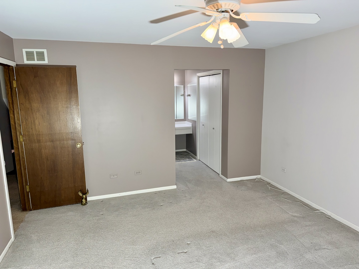 15813 Jon Road Oak Forest, IL 60452 - Photo 15 of 31 an empty room with windows and fan