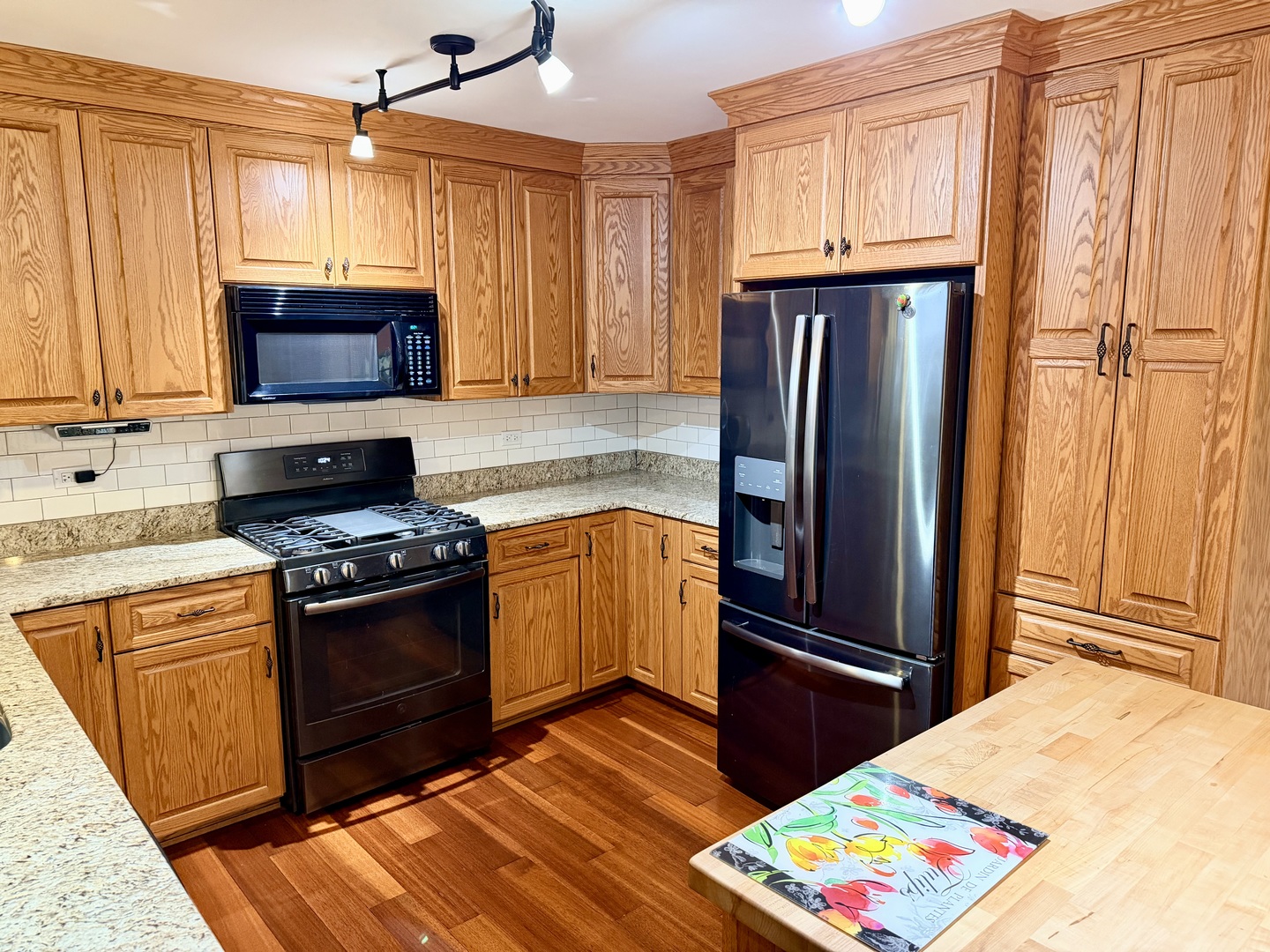 15813 Jon Road Oak Forest, IL 60452 - Photo 3 of 31 a kitchen with granite countertop wooden cabinets and stainless steel appliances