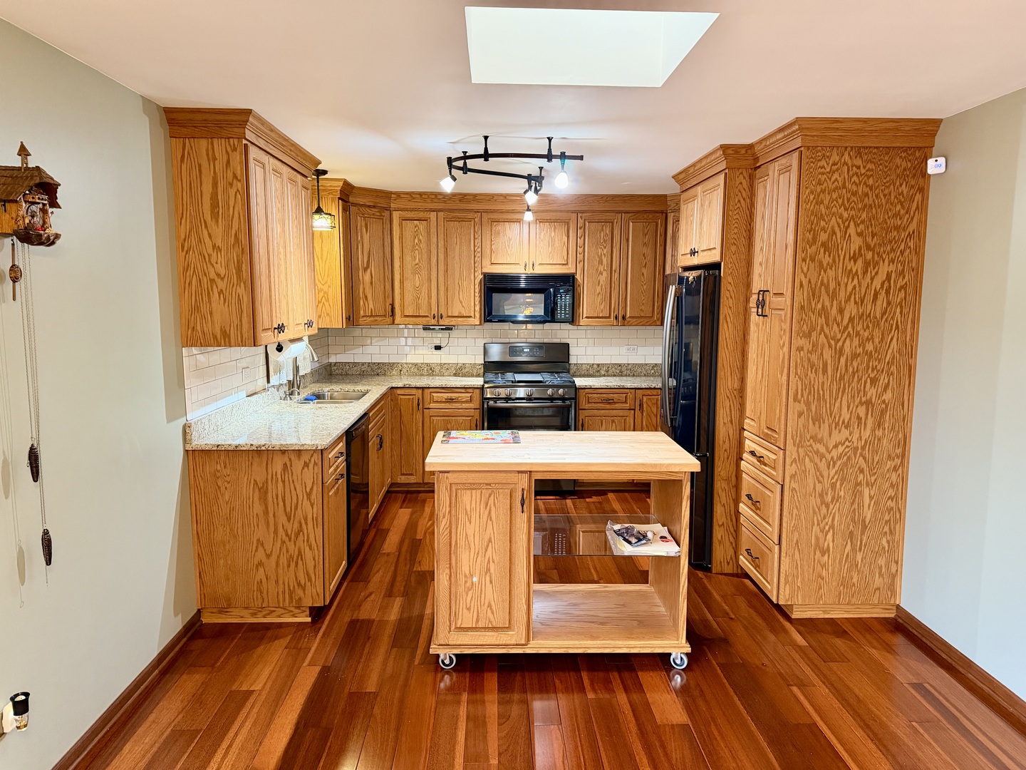 15813 Jon Road Oak Forest, IL 60452 - Photo 4 of 31 a kitchen with stainless steel appliances a stove a refrigerator and a wooden floor