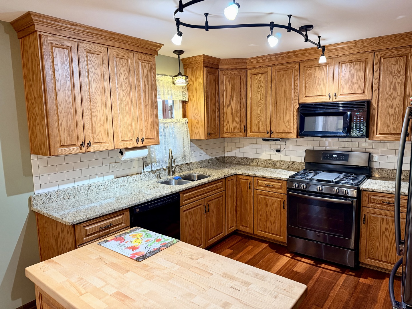 15813 Jon Road Oak Forest, IL 60452 - Photo 5 of 31 a kitchen with stainless steel appliances granite countertop a sink stove and refrigerator