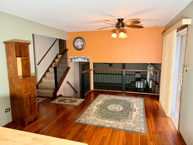 a view of a house with backyard porch and sitting area