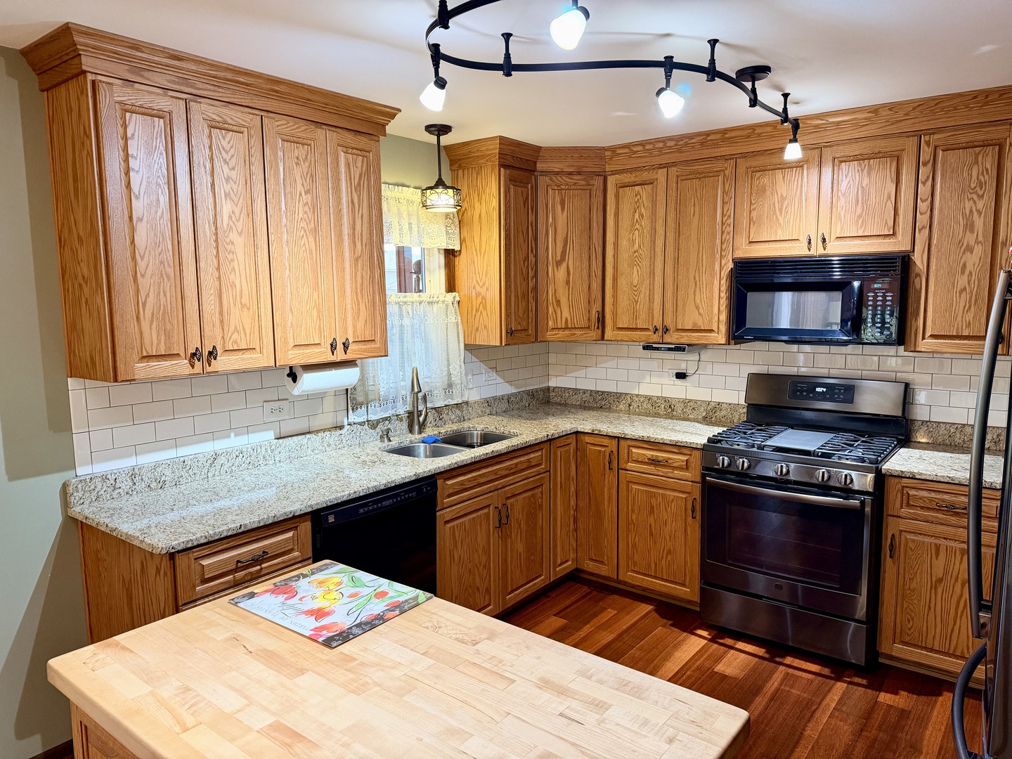 15813 Jon Road Oak Forest, IL 60452 - Photo 7 of 31 a kitchen with stainless steel appliances granite countertop a sink stove and refrigerator