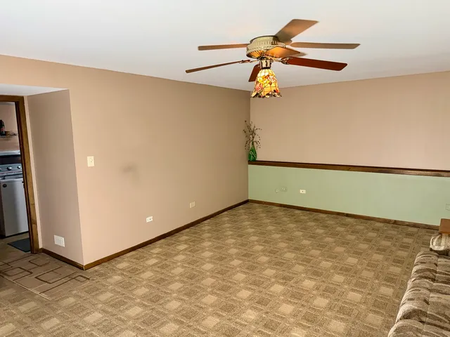 a view of a bench in wooden floor
