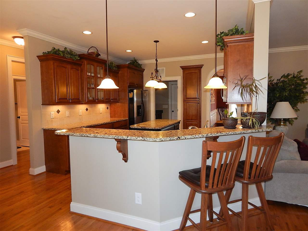 32 North Sunset Ridge Drive Willow Spring, NC 27592 - Photo 6 of 25 Includes bar stool countertop; stainless steel appliances Kitchen
