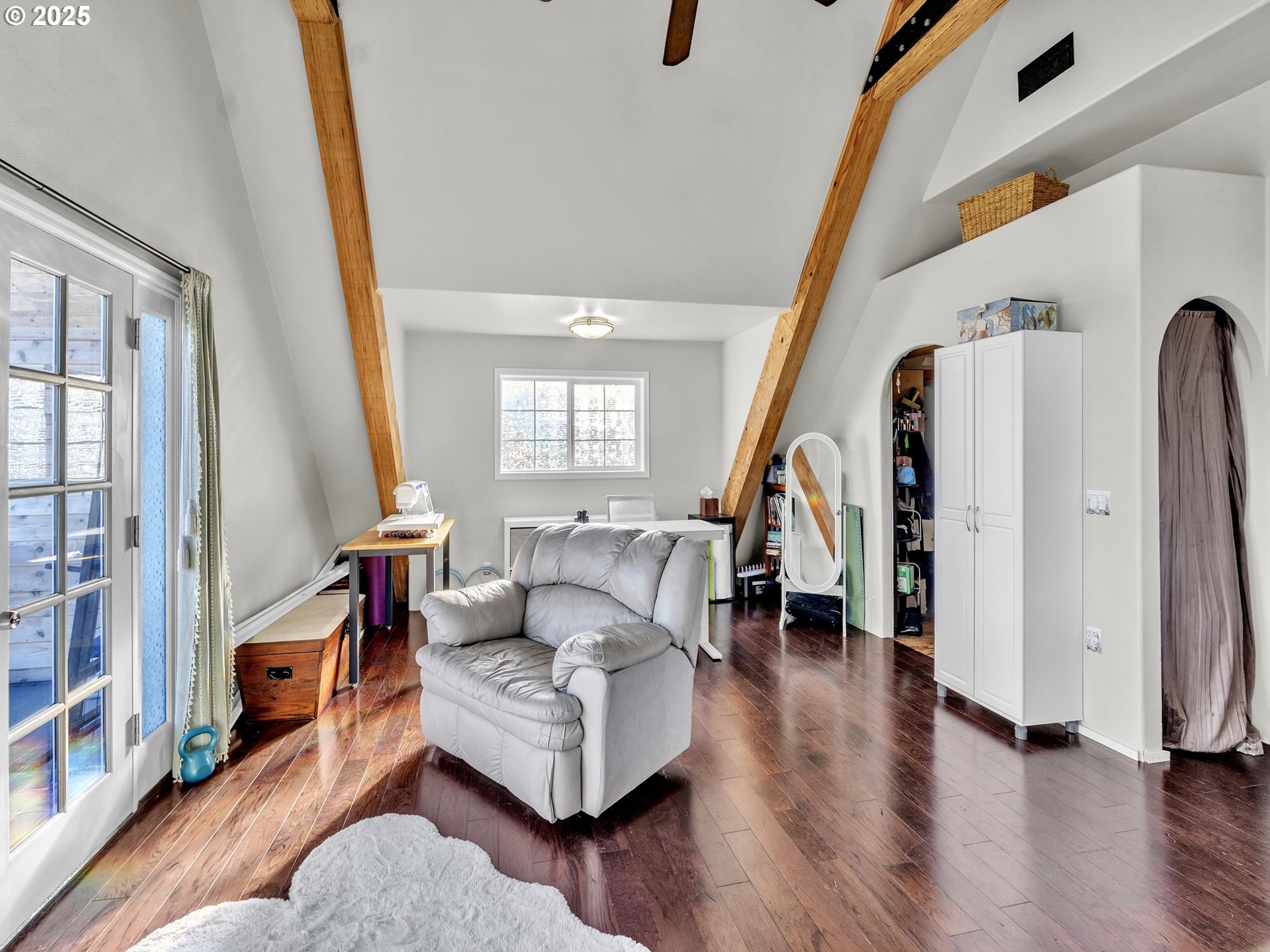 90589 Clark Road Warrenton, OR 97146 - Photo 22 of 48 a living room with furniture and a wooden floor