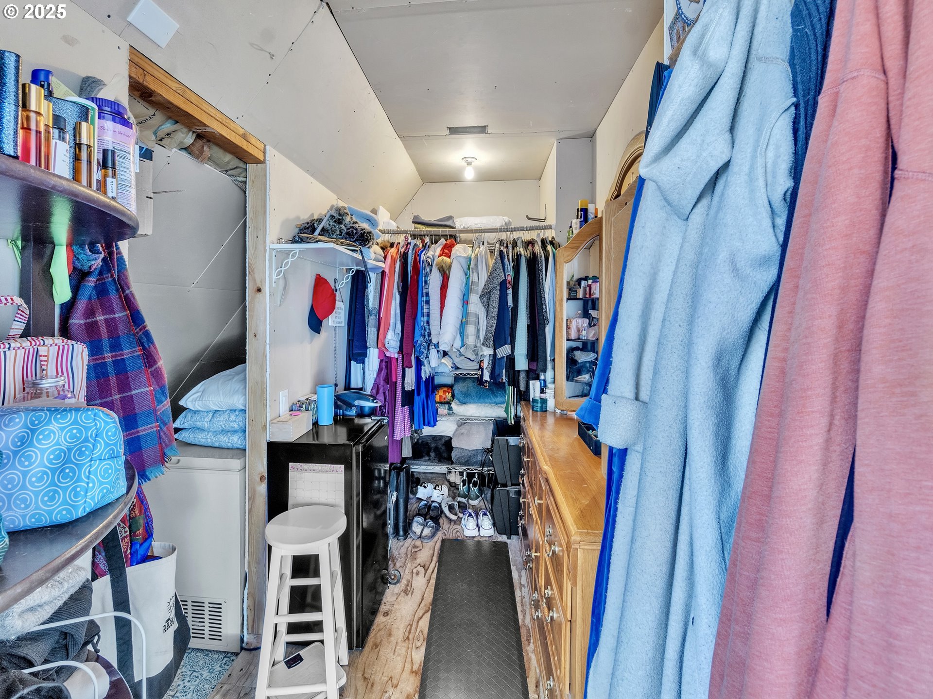 90589 Clark Road Warrenton, OR 97146 - Photo 23 of 48 a view of walk in closet with clothes and shoes