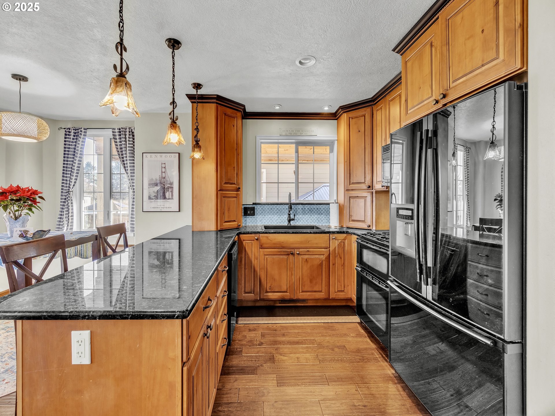 90589 Clark Road Warrenton, OR 97146 - Photo 28 of 48 a kitchen with sink a counter top space and stainless steel appliances