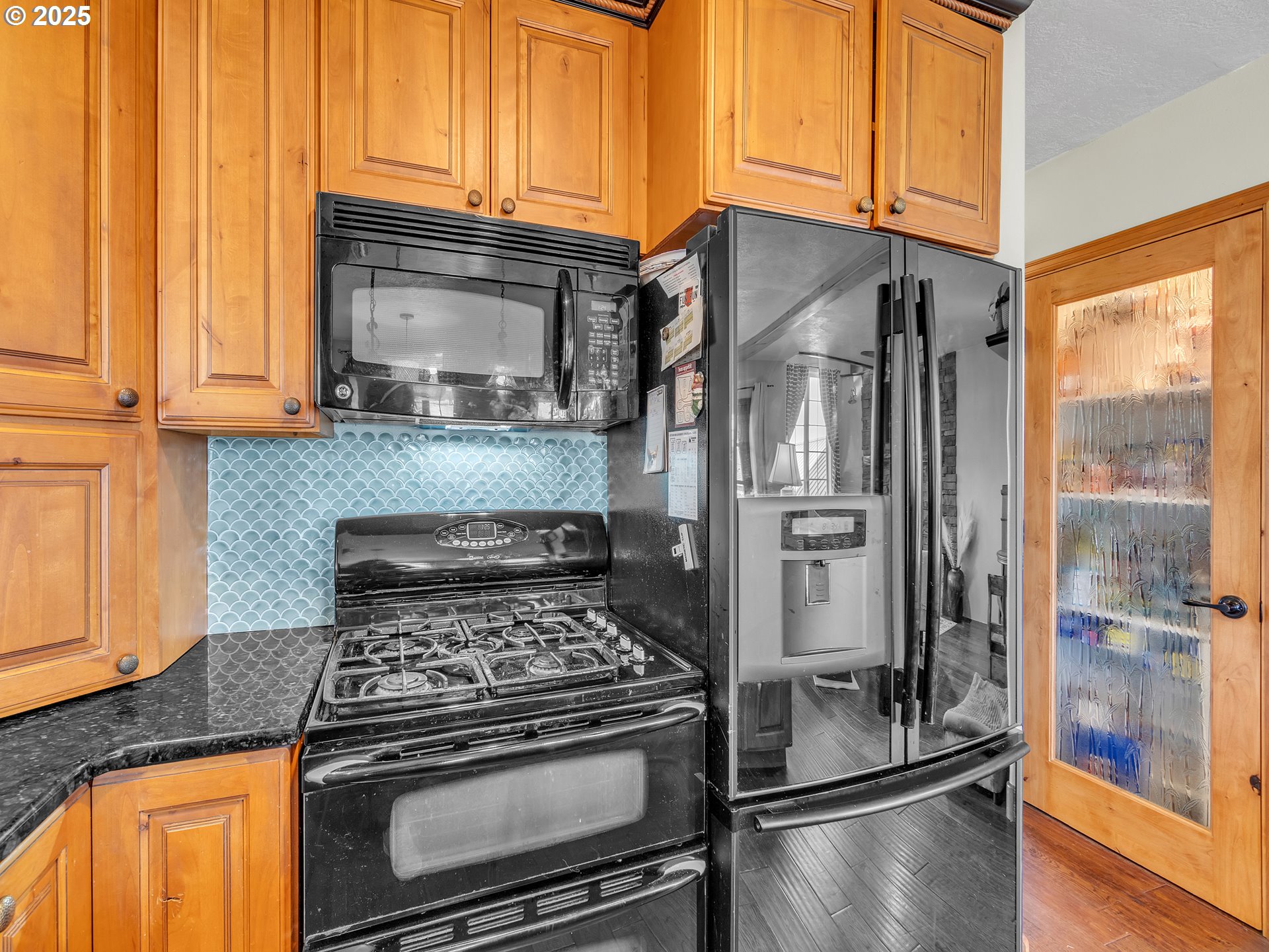90589 Clark Road Warrenton, OR 97146 - Photo 34 of 48 a kitchen with stainless steel appliances granite countertop a refrigerator and a stove