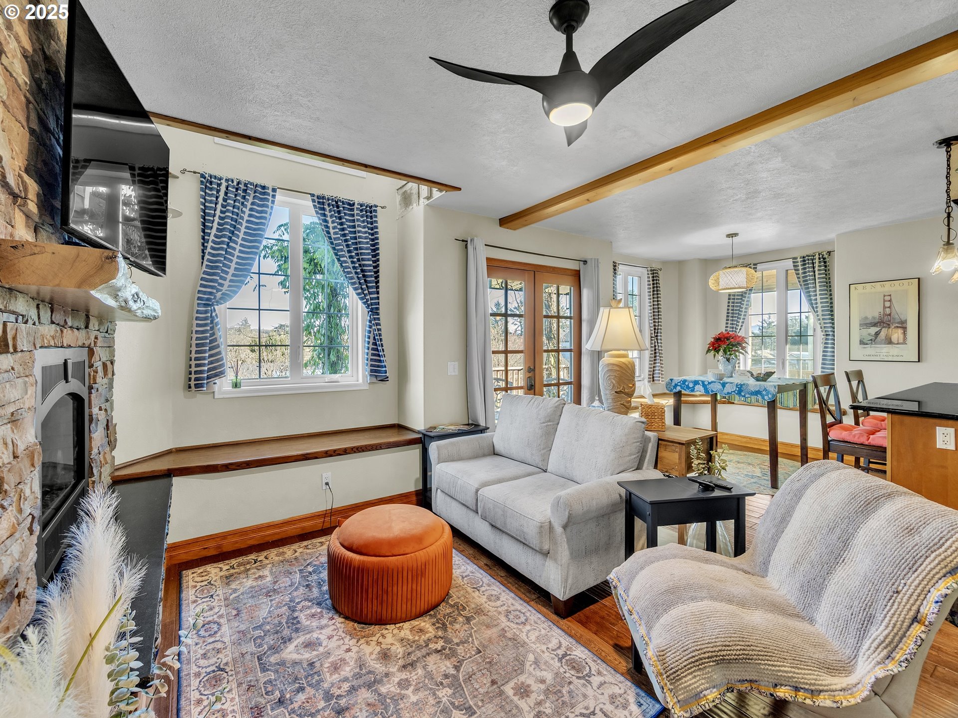 90589 Clark Road Warrenton, OR 97146 - Photo 35 of 48 a living room with furniture and a fireplace