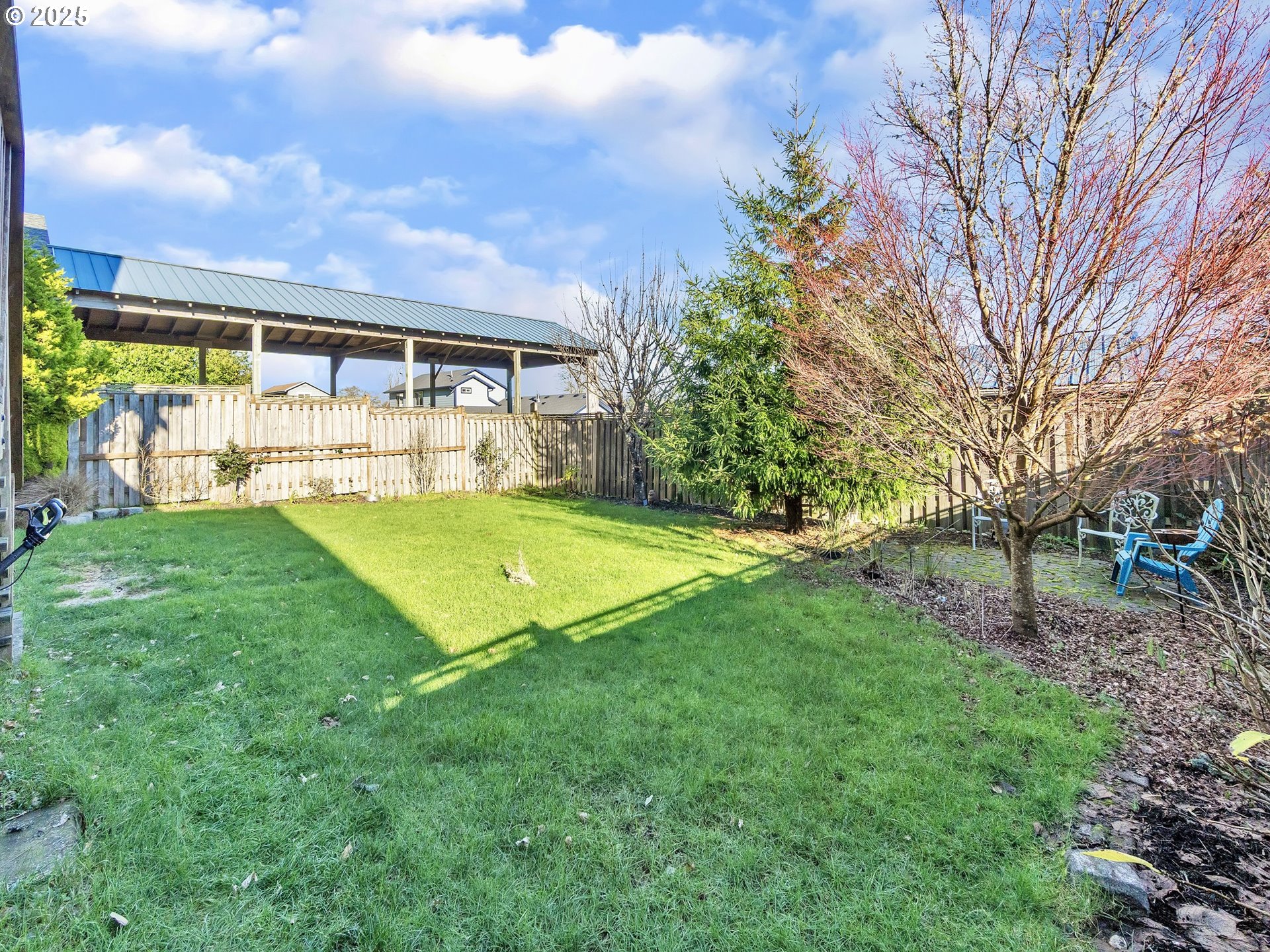 90589 Clark Road Warrenton, OR 97146 - Photo 40 of 48 a view of a house with a big yard and large trees