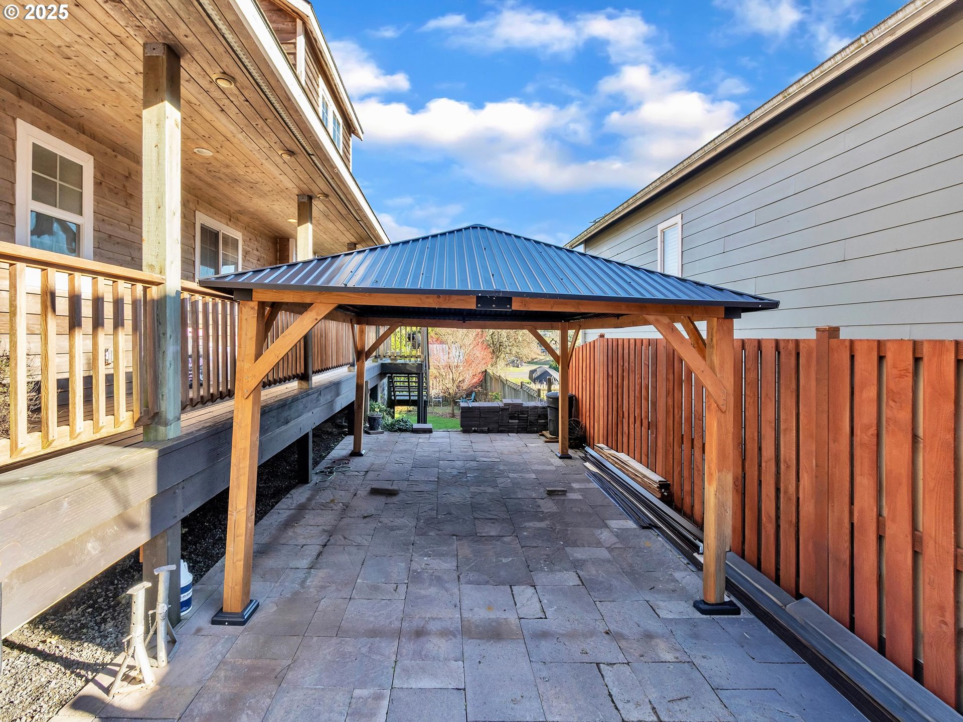 90589 Clark Road Warrenton, OR 97146 - Photo 6 of 48 a view of a porch with wooden floor and roof