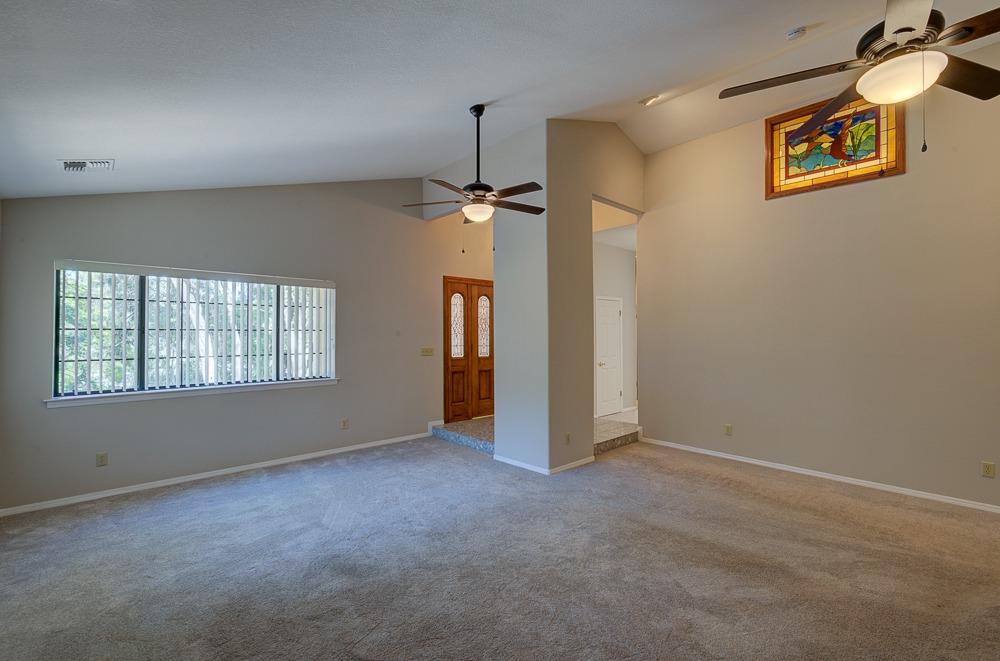 31514 Delaware Road Coarsegold, CA 93614 - Photo 4 of 49 Living room and the stain glass window lights up.