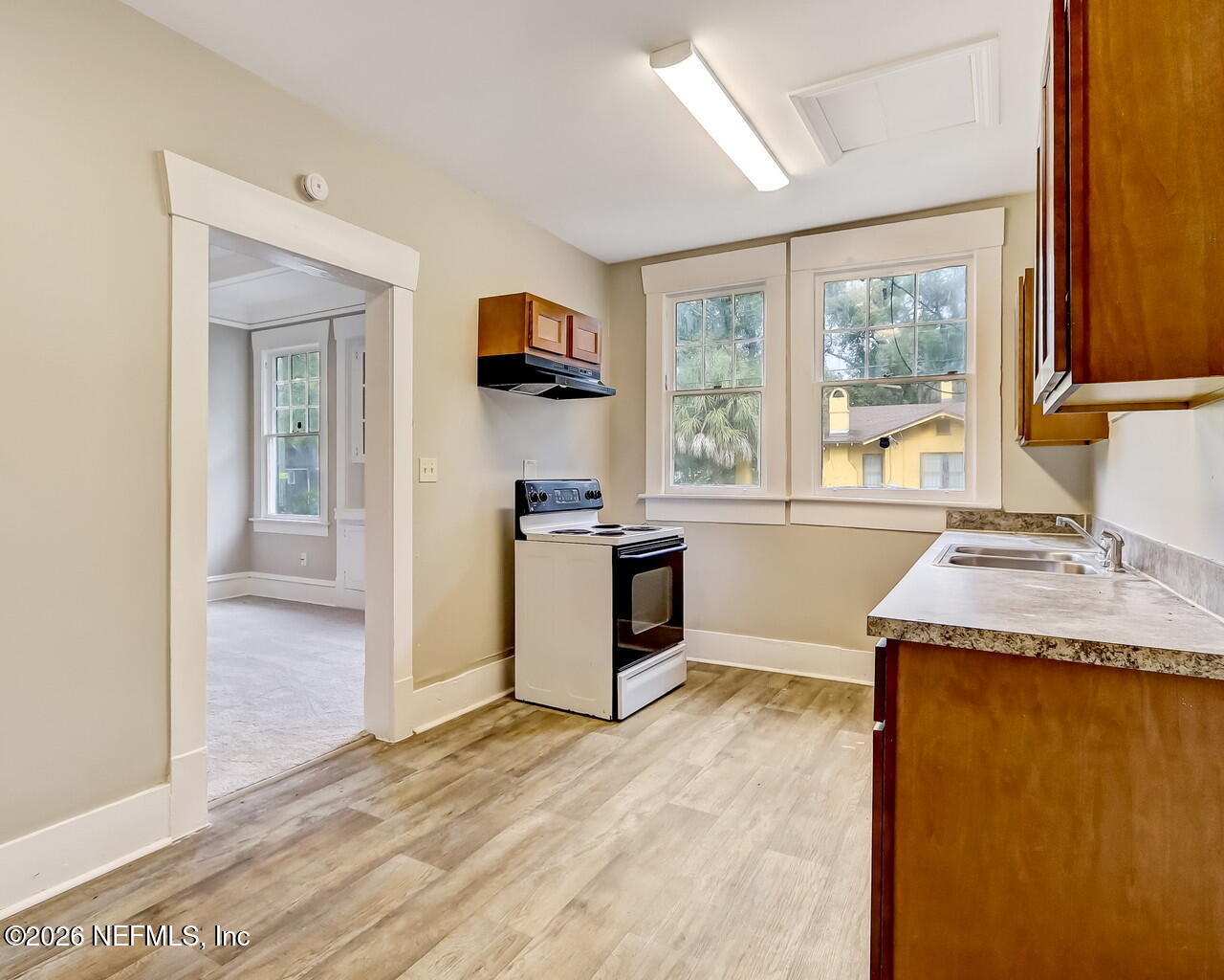 4325 Springfield Boulevard Jacksonville, FL 32206 - Photo 19 of 33 a kitchen with a stove a sink and a refrigerator