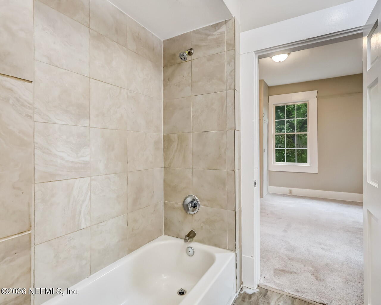 4325 Springfield Boulevard Jacksonville, FL 32206 - Photo 24 of 33 a white bath tub sitting next to a white sink and a shower