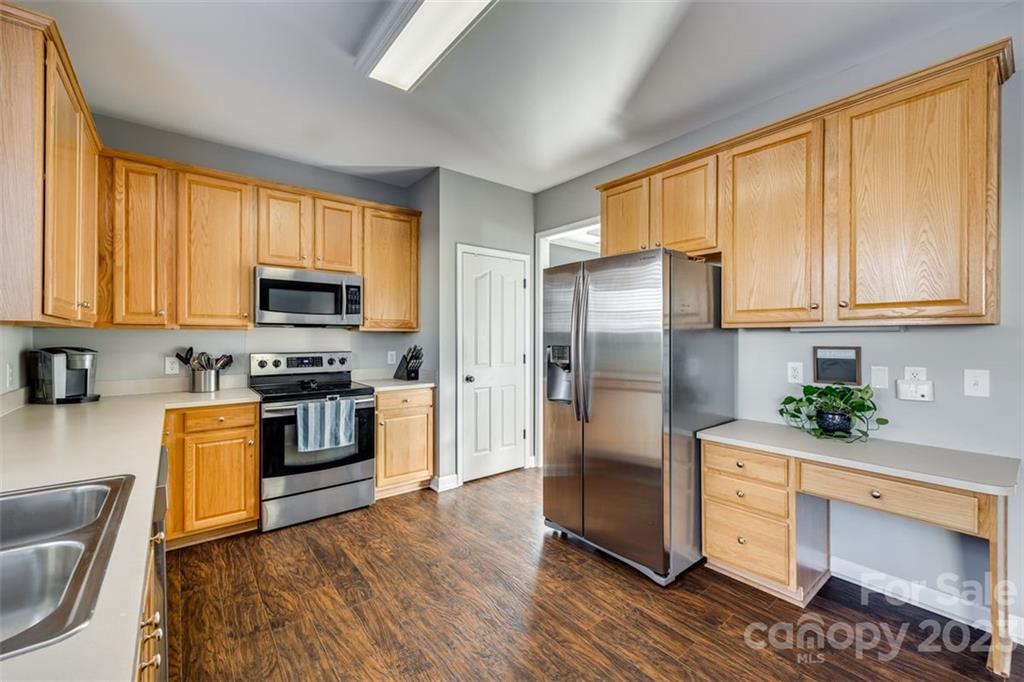 106 Anchura Road Fort Mill, SC 29708 - Photo 11 of 30 a kitchen with stainless steel appliances granite countertop a refrigerator stove top oven and sink