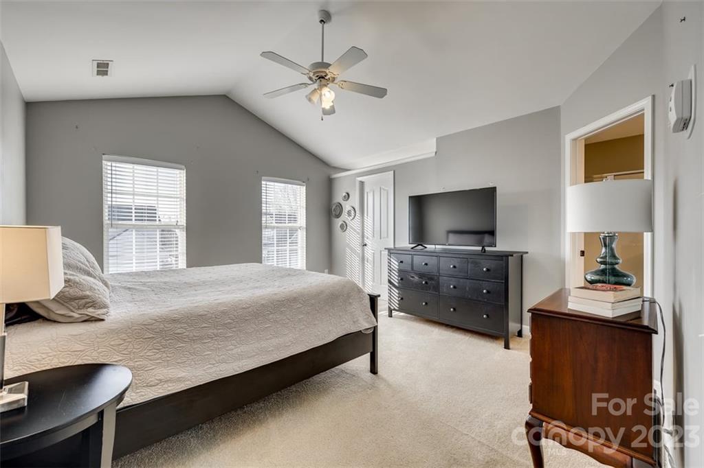 106 Anchura Road Fort Mill, SC 29708 - Photo 15 of 30 a bedroom with a bed and a flat screen tv