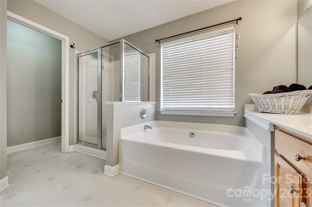 106 Anchura Road Fort Mill, SC 29708 - Photo 18 of 30 a bathroom with a bathtub and a shower
