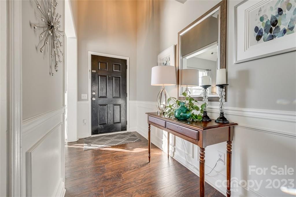 106 Anchura Road Fort Mill, SC 29708 - Photo 2 of 30 a view of a hallway view with wooden floor and staircase