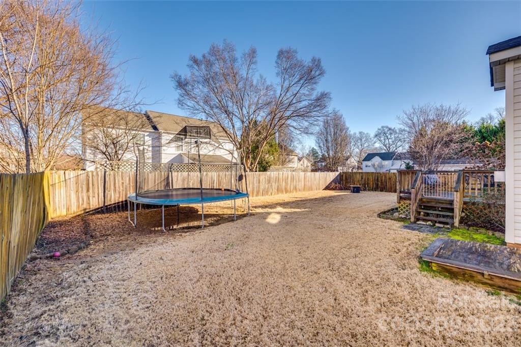106 Anchura Road Fort Mill, SC 29708 - Photo 28 of 30 a backyard of a house with barbeque oven table and chairs