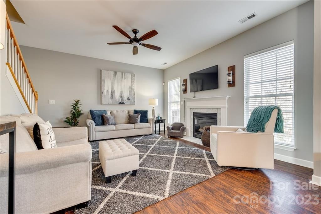 106 Anchura Road Fort Mill, SC 29708 - Photo 7 of 30 a living room with furniture a flat screen tv and a fireplace