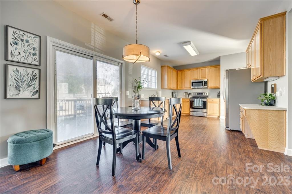 106 Anchura Road Fort Mill, SC 29708 - Photo 10 of 30 a view of a dining room with furniture window and wooden floor