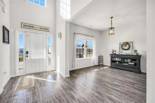 a view of livingroom with hardwood floor and a piano