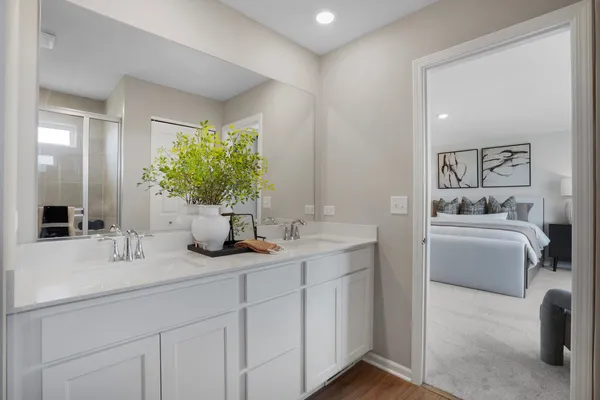 a bathroom with a granite countertop sink a large mirror and a