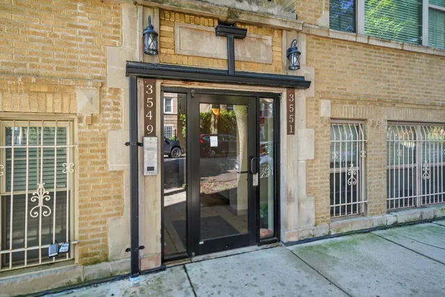 a view of a brick building with a door