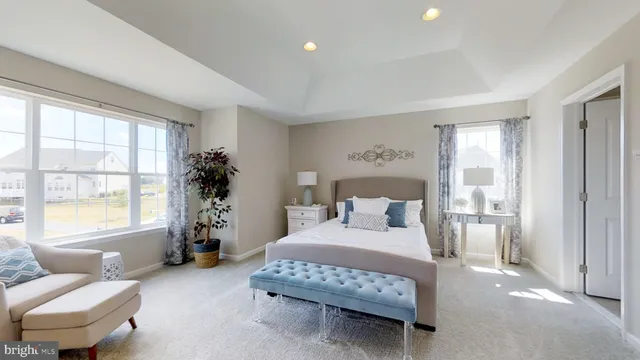 a bedroom with a bed and a couch