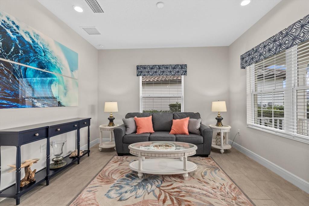 13185 Steinhatchee Loop Venice, FL 34293 - Photo 14 of 50 a living room with furniture and a window