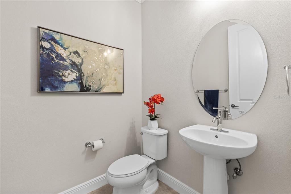 13185 Steinhatchee Loop Venice, FL 34293 - Photo 17 of 50 a bathroom with a sink mirror and toilet