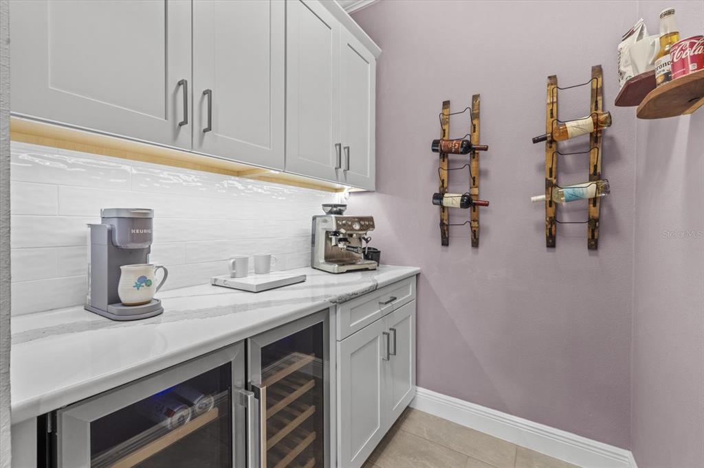 13185 Steinhatchee Loop Venice, FL 34293 - Photo 21 of 50 a kitchen with cabinets and window