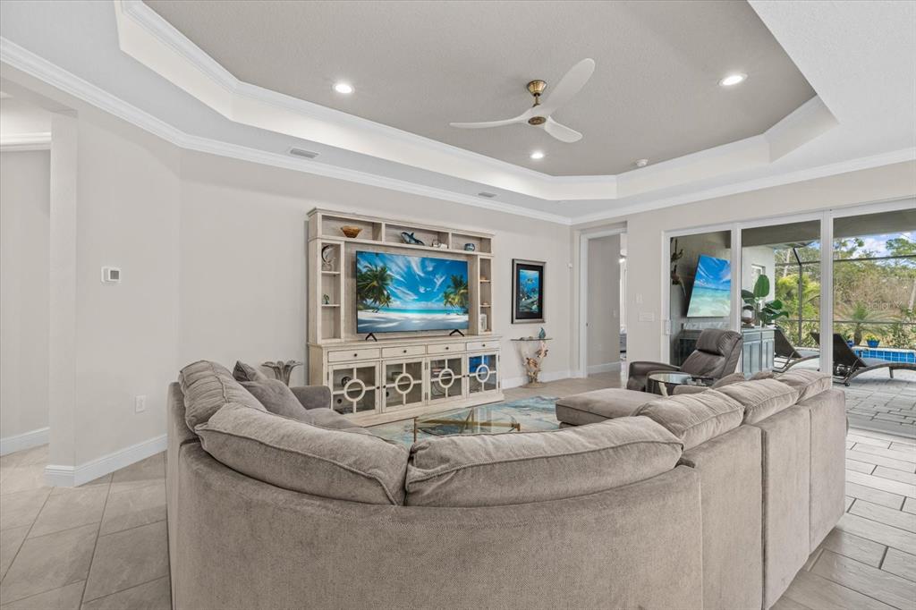 13185 Steinhatchee Loop Venice, FL 34293 - Photo 26 of 50 a living room with furniture and a flat screen tv