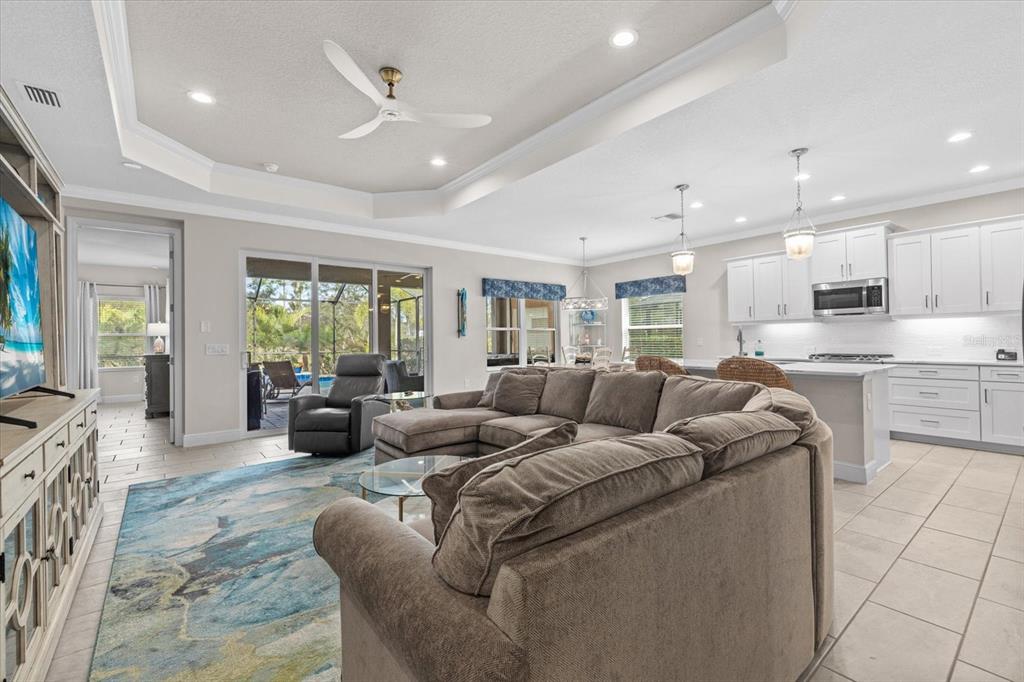 13185 Steinhatchee Loop Venice, FL 34293 - Photo 27 of 50 a living room with furniture kitchen and a large window