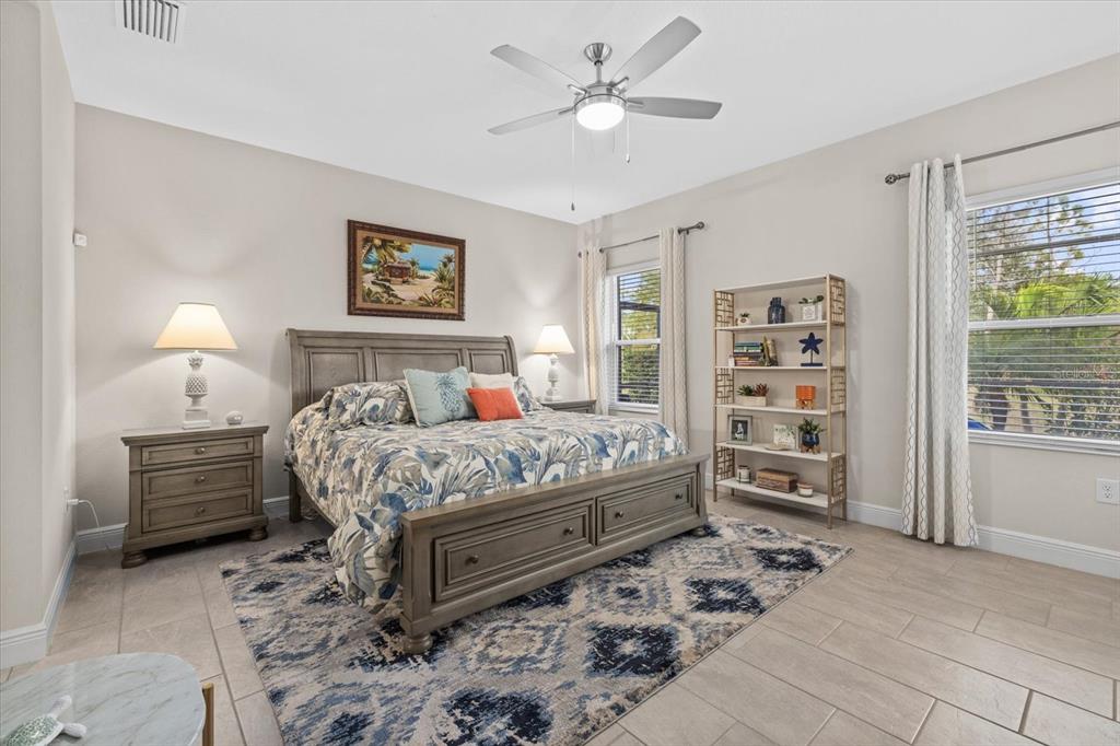 13185 Steinhatchee Loop Venice, FL 34293 - Photo 28 of 50 a bedroom with a bed dresser and a window