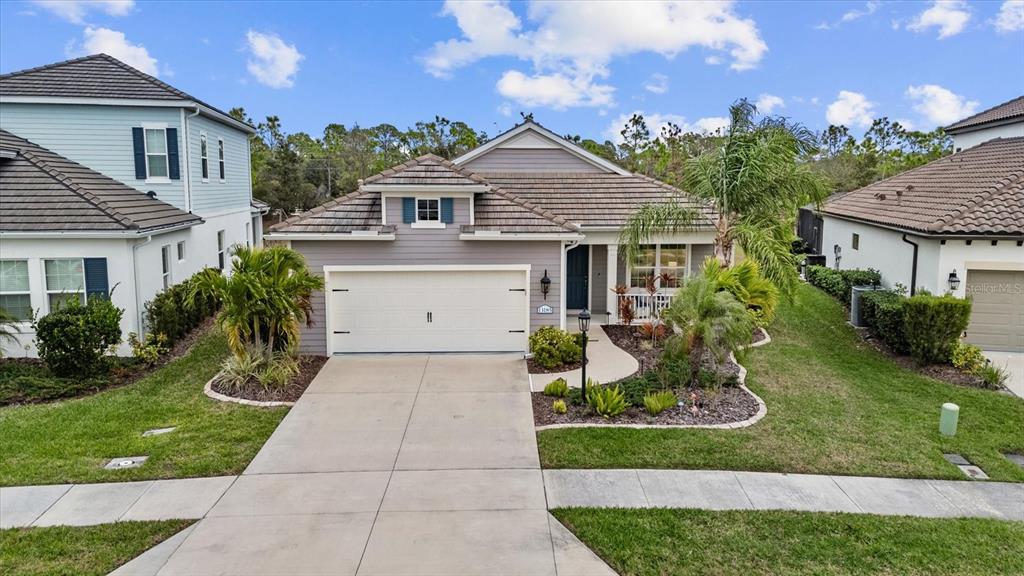 13185 Steinhatchee Loop Venice, FL 34293 - Photo 9 of 50 a front view of a house with garden