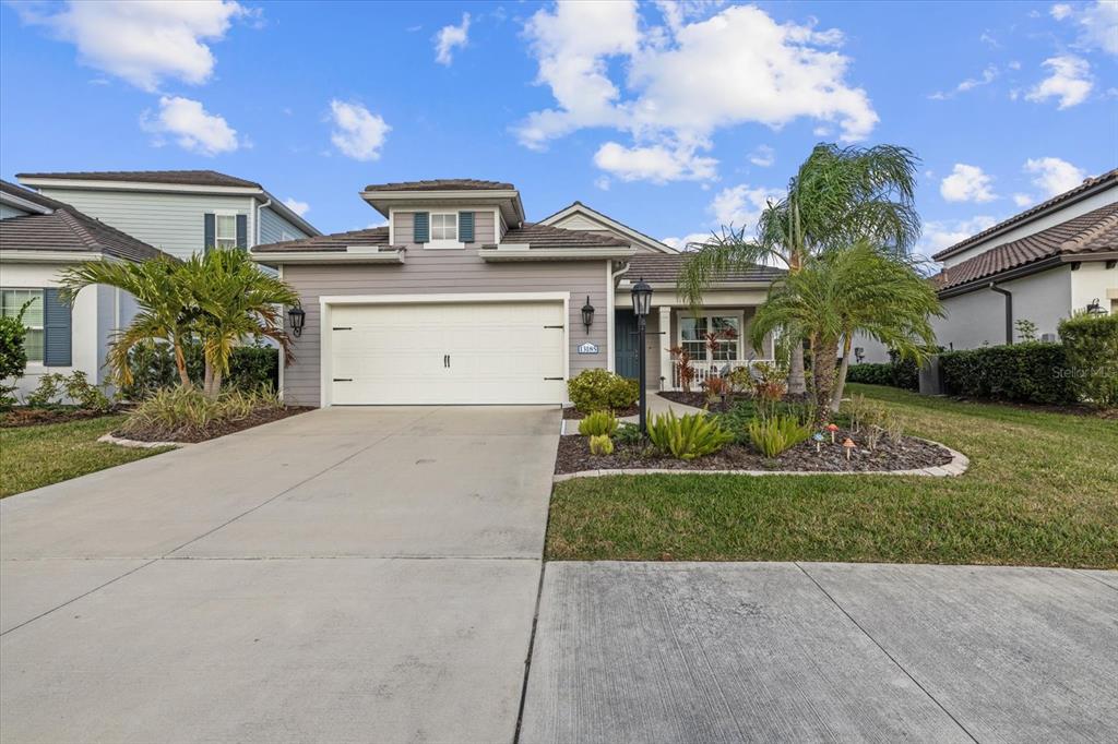 13185 Steinhatchee Loop Venice, FL 34293 - Photo 10 of 50 a front view of a house with a yard