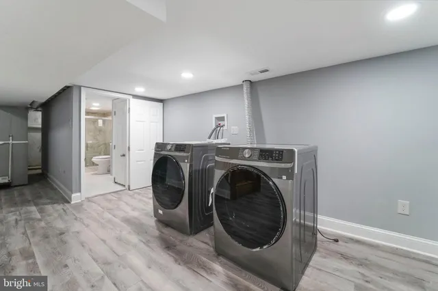 a view of a hallway with washer and dryer
