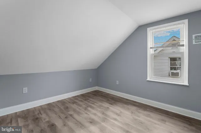 a view of a room that has a window in it