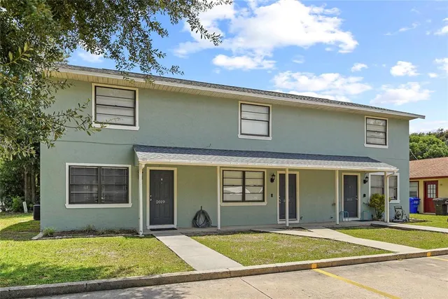 front view of a house with a yard