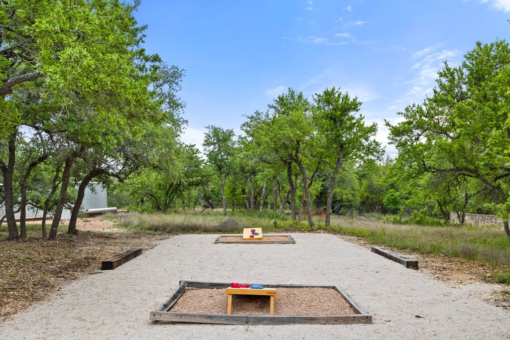 2560 Bell Springs Road Dripping Springs, TX 78620 - Photo 29 of 40 a view of a yard with a trampoline